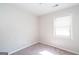 Bedroom featuring natural light and carpeted floors at 6671 Pelica Ct, Riverdale, GA 30274