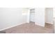 Bedroom with carpet and closet featuring rod and shelving at 6671 Pelica Ct, Riverdale, GA 30274