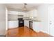Well-lit kitchen featuring white cabinetry, modern appliances, and easy-to-clean flooring at 6671 Pelica Ct, Riverdale, GA 30274