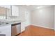 Kitchen features a stainless steel dishwasher and granite countertops at 6671 Pelica Ct, Riverdale, GA 30274