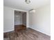 View of living room showing wood-look floors and mini split at 6671 Pelica Ct, Riverdale, GA 30274