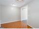 An empty room featuring unique orange and brown flooring at 6671 Pelica Ct, Riverdale, GA 30274
