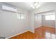 View of a room featuring neutral walls and unique tile flooring, with AC unit at 6671 Pelica Ct, Riverdale, GA 30274