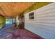 Unfinished screened porch featuring walls, windows and view of backyard at 6671 Pelica Ct, Riverdale, GA 30274