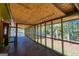 Spacious screened porch with natural light and views of the private, wooded backyard at 6671 Pelica Ct, Riverdale, GA 30274