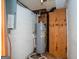A utility room features a hot water tank and white brick walls at 6671 Pelica Ct, Riverdale, GA 30274