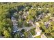 Aerial view displaying houses nestled among lush trees in a peaceful neighborhood at 3192 Creek W Trce, Powder Springs, GA 30127