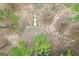 Overhead view of a backyard with a stone tile patio and a stepping stone pathway through the trees at 3192 Creek W Trce, Powder Springs, GA 30127