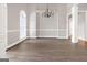 Formal dining room with hardwood-style floors and modern chandelier at 3192 Creek W Trce, Powder Springs, GA 30127