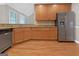 Traditional kitchen featuring oak cabinets, granite countertops, and stainless steel appliances at 3192 Creek W Trce, Powder Springs, GA 30127