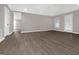 Living room features vinyl floors, neutral paint, recessed lighting and glass paneled door at 3192 Creek W Trce, Powder Springs, GA 30127