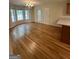 Bright dining room with hardwood floors and large windows at 4755 Jersey Walnut Grove Rd, Covington, GA 30014