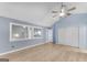 Bedroom with light blue walls, laminate flooring, and a ceiling fan at 4234 Stillwater Dr, Duluth, GA 30096