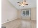 Living room with vaulted ceiling, laminate flooring, and ceiling fan at 4234 Stillwater Dr, Duluth, GA 30096