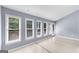 Sunroom with multiple windows and hardwood floors at 4234 Stillwater Dr, Duluth, GA 30096