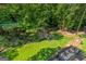 Elevated view of expansive lawn and wooded area at 3946 Paces Ferry Nw Rd, Atlanta, GA 30327