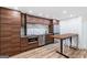 Modern basement kitchen with wood cabinets and stainless steel appliances at 3946 Paces Ferry Nw Rd, Atlanta, GA 30327