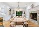 Formal dining room with a marble fireplace and a large dining table at 3946 Paces Ferry Nw Rd, Atlanta, GA 30327