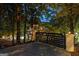 Private gated entrance to a luxurious home in a wooded setting at 3946 Paces Ferry Nw Rd, Atlanta, GA 30327