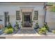 Elegant entryway with a grand black door and a stone pathway at 3946 Paces Ferry Nw Rd, Atlanta, GA 30327