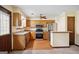 Galley style kitchen with stainless steel appliances and wood cabinets at 6698 Cameron Rd, Morrow, GA 30260