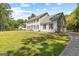 Charming two-story home featuring a large, well-manicured front lawn, attached garage, and traditional architecture at 330 N Fayette Dr, Fayetteville, GA 30214