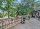 Stone balcony overlooks lake; features balustrade and planters at 2554 Emerald Dr, Jonesboro, GA 30236