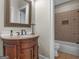 Charming bathroom with wood vanity, granite countertop, and shower at 2554 Emerald Dr, Jonesboro, GA 30236