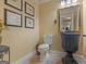 Stylish powder room with ornate vanity and gold mirror at 2554 Emerald Dr, Jonesboro, GA 30236