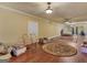 Large bonus room with hardwood floors, two chairs, and a round rug at 2554 Emerald Dr, Jonesboro, GA 30236