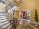 Grand entryway with a curved staircase and views into the dining room at 2554 Emerald Dr, Jonesboro, GA 30236