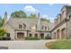 Elegant stone house with a circular driveway at 2554 Emerald Dr, Jonesboro, GA 30236