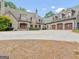 Stone house with circular driveway and three-car garage at 2554 Emerald Dr, Jonesboro, GA 30236