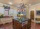 Elegant kitchen with custom cabinetry, granite countertops, and island at 2554 Emerald Dr, Jonesboro, GA 30236