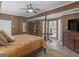 Main bedroom with a four-poster bed and bay window at 2554 Emerald Dr, Jonesboro, GA 30236