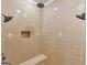 Large walk-in shower with dual shower heads and tiled bench at 2554 Emerald Dr, Jonesboro, GA 30236