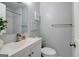 Modern bathroom featuring a white vanity, toilet, mirror, and subway tile shower at 749 Casplan Sw St, Atlanta, GA 30310