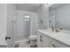 Bright bathroom featuring a white vanity, toilet, and shower with subway tiles at 749 Casplan Sw St, Atlanta, GA 30310