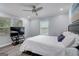 Bright bedroom featuring wood-look floors, a ceiling fan, and large windows at 749 Casplan Sw St, Atlanta, GA 30310