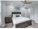 Neutral bedroom boasts a dark wood bedframe, stylish decor, and recessed lighting at 749 Casplan Sw St, Atlanta, GA 30310