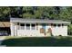 Charming single-story home with a well-manicured lawn and inviting blue front door at 749 Casplan Sw St, Atlanta, GA 30310