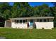 Charming single-story home with a well-manicured lawn and inviting blue front door at 749 Casplan Sw St, Atlanta, GA 30310