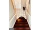 Dark wood staircase leading to the upper level at 3870 Michaels Creek Ct, Loganville, GA 30052