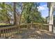 Wooden deck with railing offering backyard and neighborhood views at 2632 Oakdale Nw St, Atlanta, GA 30318