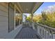 Inviting front porch with gray railings and wood flooring at 2632 Oakdale Nw St, Atlanta, GA 30318