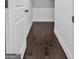 Dark hardwood floor hallway with white door and baseboards at 2632 Oakdale Nw St, Atlanta, GA 30318