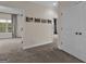 Carpeted hallway with doors to bedrooms and neutral walls at 2632 Oakdale Nw St, Atlanta, GA 30318