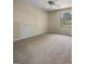 Bedroom with neutral carpeting, a ceiling fan, and a view from the window at 9997 Point View Dr, Jonesboro, GA 30238