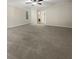 This primary bedroom features plush carpeting, neutral paint, and a large closet at 9997 Point View Dr, Jonesboro, GA 30238