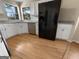 Updated kitchen featuring white cabinets, granite countertops, and stainless steel appliances at 9997 Point View Dr, Jonesboro, GA 30238